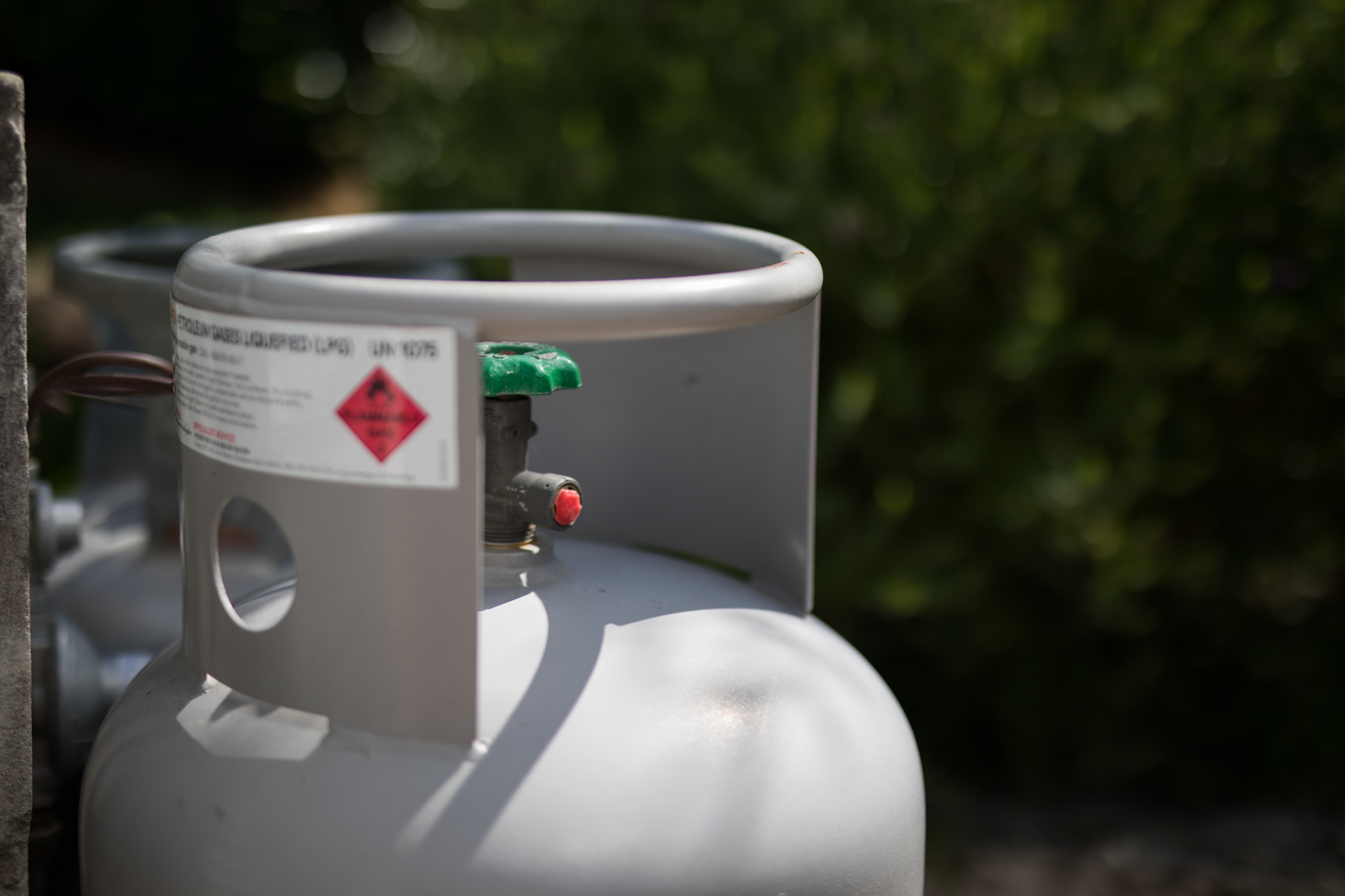 Photo of propane cylinder with warning label